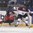 POPRAD, SLOVAKIA - APRIL 13: Latvia's Toms Opelts #14 avoids a body check from Canada's Akil Thomas #16 during preliminary round action at the 2017 IIHF Ice Hockey U18 World Championship. (Photo by Andrea Cardin/HHOF-IIHF Images)

